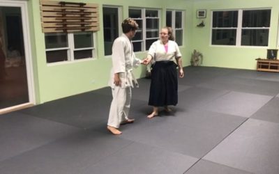 Signe demonstrating Kaiten Nage Ura on Ben during class last night #bermudaaikikai #aikikai  #usafdojo #aikidoaikikai #kaitennage #ukemi #aikidoka #aikidowoman #fundementals