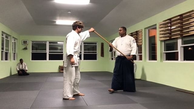 Eugene demonstrates how nikkyo using the jo is the same movement as the open hand nikkyo we are more used to